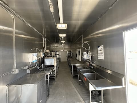 Interior layout of a commercial kitchen with preparation and washing areas
