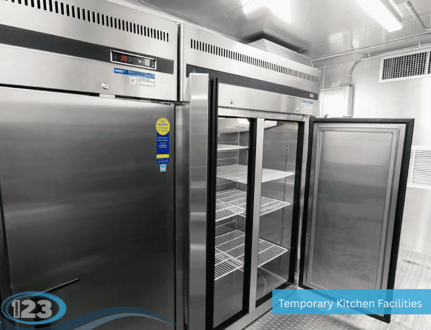 Open stainless-steel refrigerated storage units inside a commercial kitchen